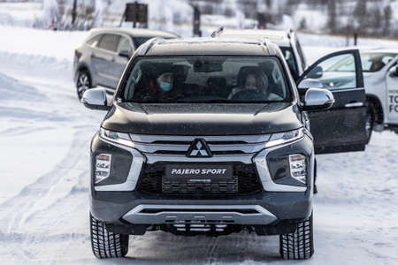 Moscow, Russia - February 17, 2021: All new Mitsubishi Pajero Sport. Facelifted suv. winter, the car is tested at the test site the front of the updated SUV. Front and half viewのeditorial素材