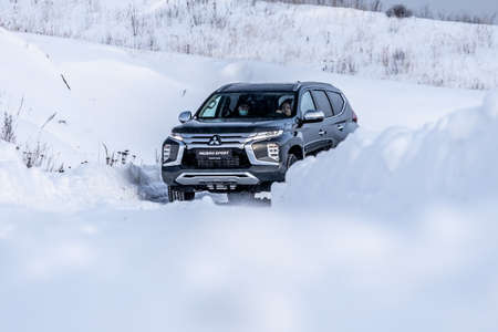 Moscow, Russia - February 17, 2021: All new Mitsubishi Pajero Sport. Facelifted suv. winter, the car is tested at the test site the front of the updated SUV. Front and half viewのeditorial素材