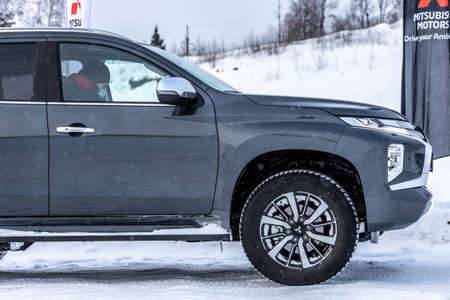 Moscow, Russia - February 17, 2021: All new Mitsubishi Pajero Sport. Details. Closeup of LED headlights, bumper, hood, radiator grill, taillights, side fenders, mirrors.のeditorial素材