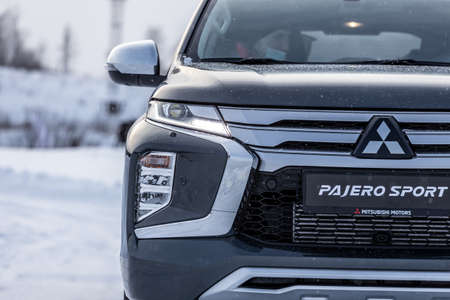 Moscow, Russia - February 17, 2021: All new Mitsubishi Pajero Sport. Facelifted suv. winter, the car is driving off-road. the front of the updated SUV.のeditorial素材