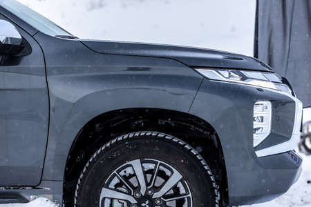 Moscow, Russia - February 17, 2021: All new Mitsubishi Pajero Sport. Details. Closeup of LED headlights, bumper, hood, radiator grill, taillights, side fenders, mirrors.のeditorial素材