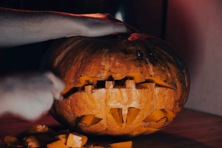The process of carving a Halloween pumpkin.の写真素材