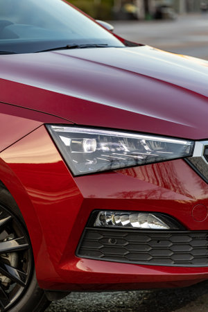 MOSCOW, RUSSIA - OCTOBER 10, 2022: Red Skoda Rapid headlights verticalのeditorial素材