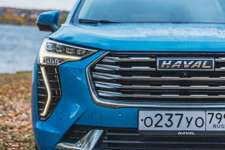 Moscow, Russia - November 04, 2022: New blue color Haval Jolion at the edge of the river. All wheel drive suv at the natureのeditorial素材
