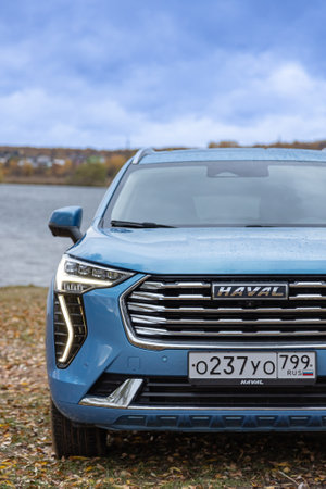 Moscow, Russia - November 04, 2022: New blue color Haval Jolion at the edge of the river. All wheel drive suv at the natureのeditorial素材