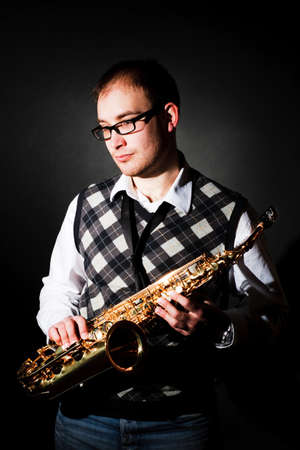 portrait of a man with a saxophoneの写真素材