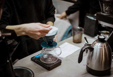 Barista at work, brewing special brew coffee.の写真素材