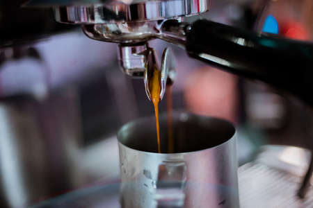 Close-up of espresso pouring from coffee machine. Professional coffee brewing.Soft focusの写真素材