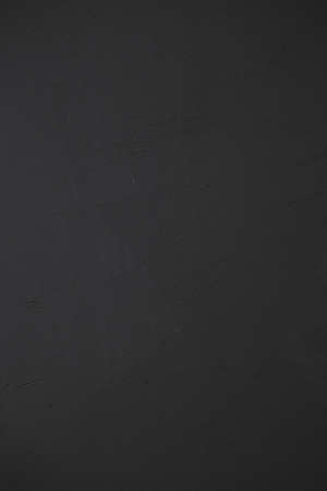 Black matte wood wall texture background, close up.の写真素材