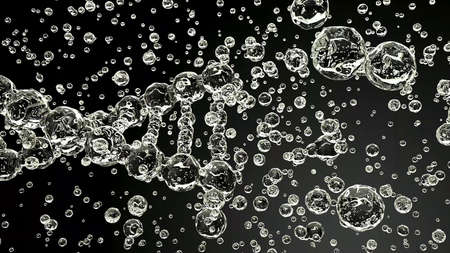 Abstract shapes of multiple air bubbles on a black backgroundの写真素材
