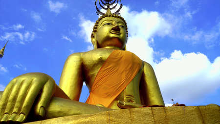 The Buddha meditated on a beautiful day in the skyの写真素材