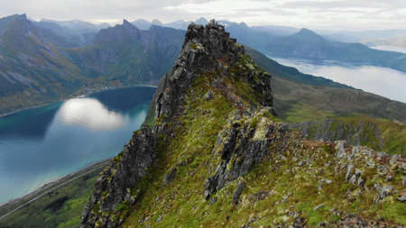 Close-up view of the top of the mountain, surrounded by fjords and other mountains on the Lofoten...