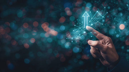 Businessman hand touching digital business chart on blue bokeh backgroundの素材