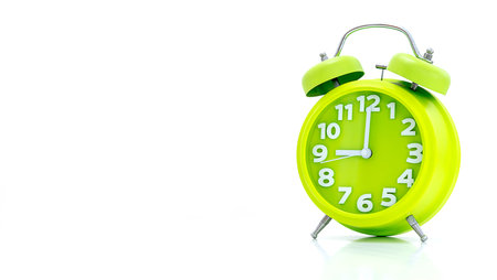 alarm clock isolated on a white backgroundの写真素材
