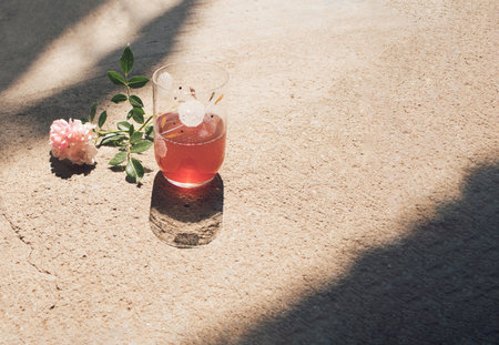 Summertime 2021. Summer vibes. Pears, fresh drink and roseblossom on summer sun. minimal creative concept. Natural background.の写真素材