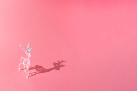 Christmas and New year 2022 concept. Diamond sparkling deer on pale rose background. Minimal copy space concept.の写真素材