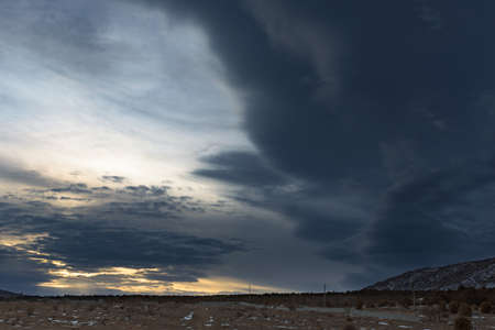 Dramatic sky beautiful winter landscape with a mountain. Russia, Stary Krym.の写真素材