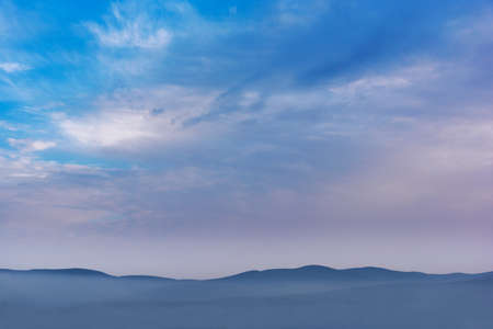 Foggy mountains clouds and sky landscapeの写真素材