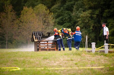 Germany, Niederstetten, Baden Wurttemberg. September 2019 Young firefighters in training with fire...