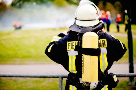 Germany, Niederstetten, Baden Wurttemberg. September 2019. Firefighter in uniform from a back.