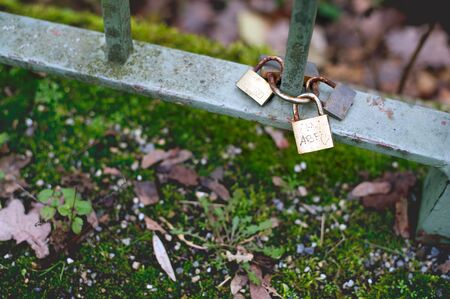Two golden locks on the bridge as a symbol of love.