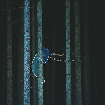 The cute Ghost hiding behind the tree. Ghost in dark wood. Illustration in photography.の写真素材