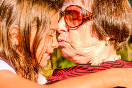 Grandmother is holding her Granddaughter