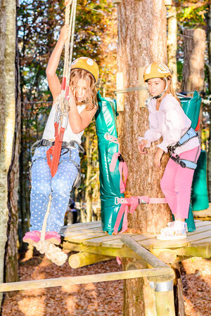 Little girl climbing in adventure parkの写真素材