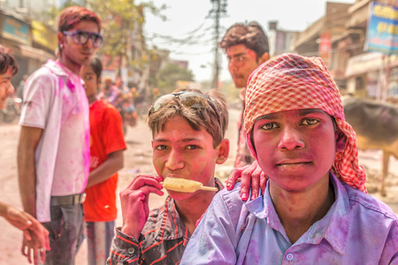 New Delhi India  March 6 2015:Young boys with a painted faces celebrating Holi festival in Indiaのeditorial素材