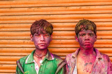 New Delhi India  March 6 2015:Young boys with a painted faces celebrating Holi festival in Indiaのeditorial素材