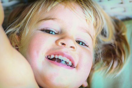 Portrait of a beautifull two year old  girl with blonde hairの写真素材