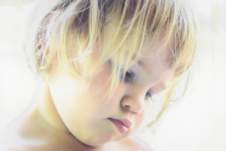 Portrait of a beautifull two year old  girl with blonde hairの写真素材