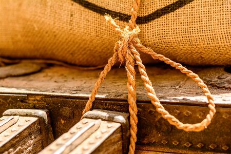 Old rope used to tide up bags of grainの写真素材
