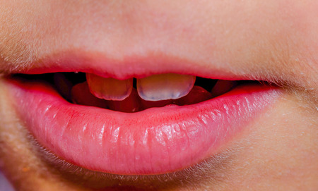 Little girls mouth close up isolatedの写真素材
