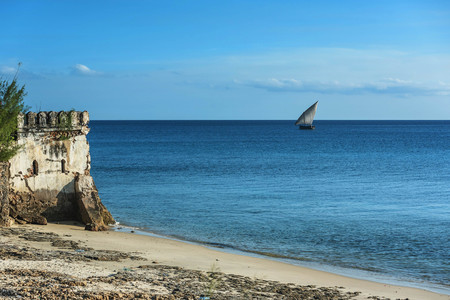 Traditional Tanzanian dhow boats on open sea close to Stone Town on Zanzibar Island, Tanzaniaの写真素材