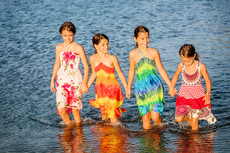 Four little girls having fun in the water in Ada bojana, Montenegroの写真素材