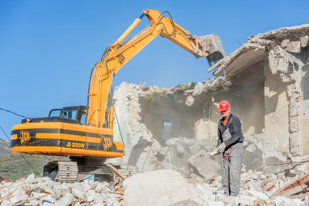 Tivat, Montenegro- December 7, 2016:Demolition of an old house with excavatorのeditorial素材