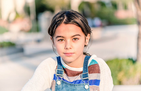 Beautiful little girl smiling and looking at the camera
