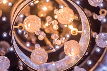 A cut glass chandeliere closeup at nightの写真素材
