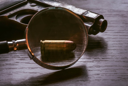 Beretta pistol with 9mm caliber bullet