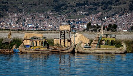 Weathered reed boats along the coast of Lake Titicaca in Puno, Peruのeditorial素材