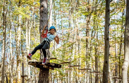 Beautiful little girl having fun in adventure Park, Montenegro