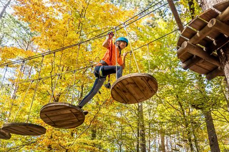 Beautiful little girl having fun in adventure Park, Montenegroの写真素材