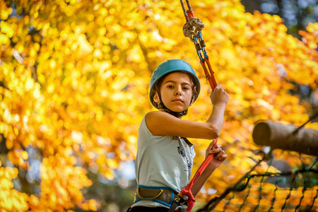 Beautiful little girl having fun in adventure Park, Montenegro