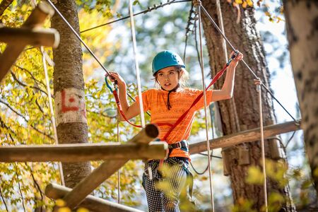 Beautiful little girl having fun in adventure Park, Montenegroの写真素材