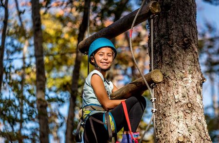 Beautiful little girl having fun in adventure Park, Montenegroの写真素材