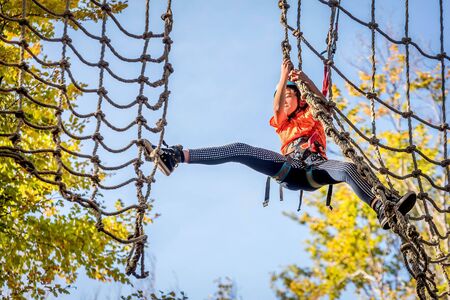 Beautiful little girl having fun in adventure Park, Montenegroの写真素材