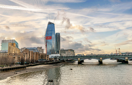 A view across the River Thames of financial skyscrapers of London,UKの写真素材