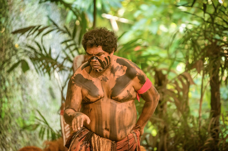Queensland, Australia- Mach 16, 2018: Aborigine actor performs  in the Tjapukai Culture Park in Kuranda, Queensland, Australiaのeditorial素材