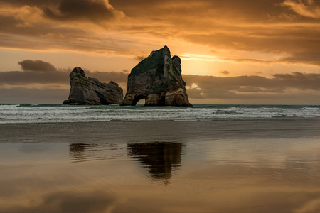 Archway Islands on the beach at Wharariki Beach near Nelson, New Zealandの写真素材